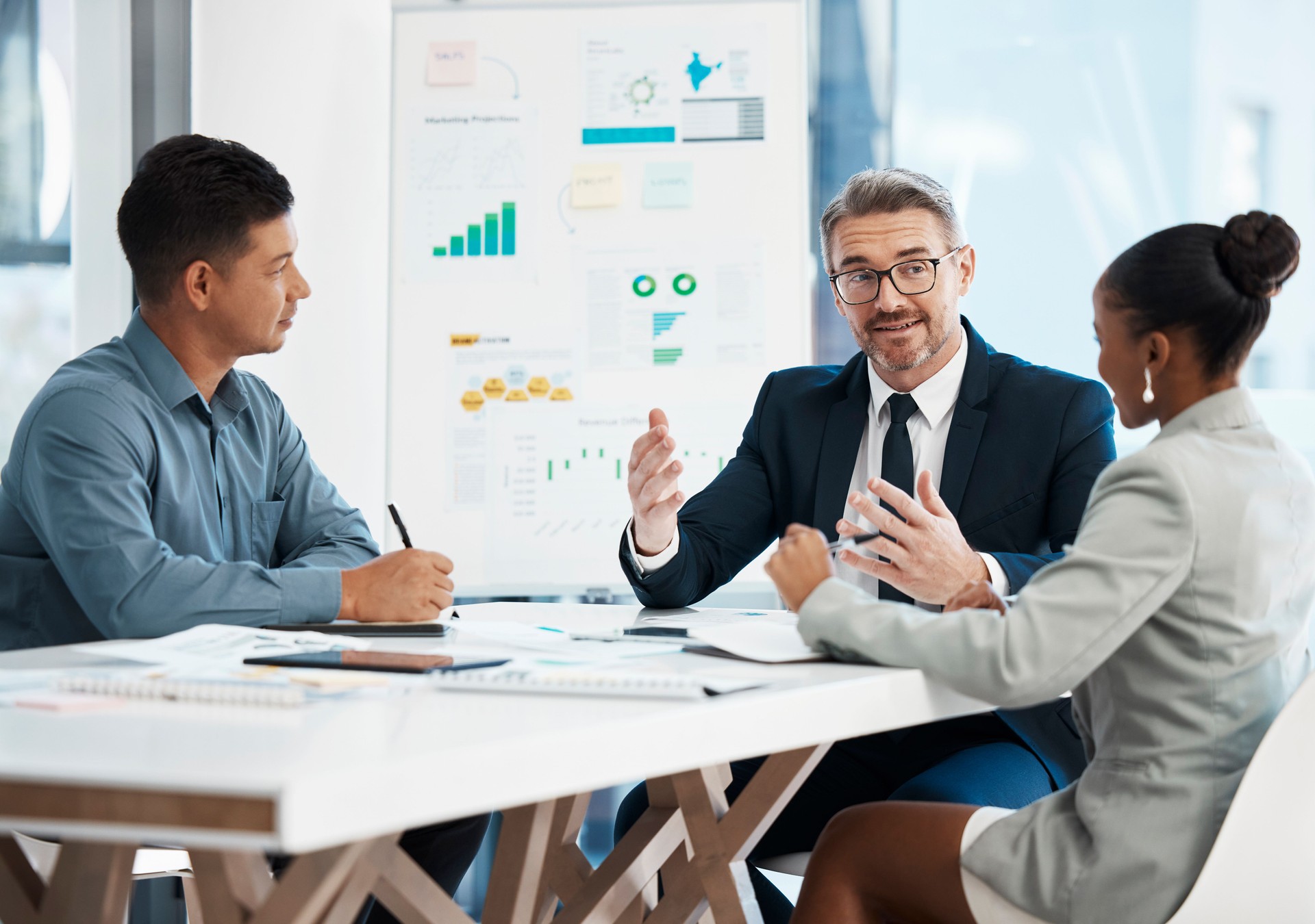 Business manager, accountant or investor in a finance, marketing or company meeting presentation with team of investment advisors or boardroom members. Corporate people planning strategy and growth